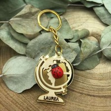 Bomboniera Laurea Portachiavi con Mappamondo e Coccinella