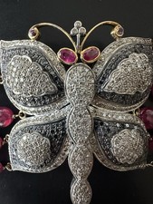 Bracciale “Farfalla” in oro 18k e argento con 85 ct rubini naturali e diamanti