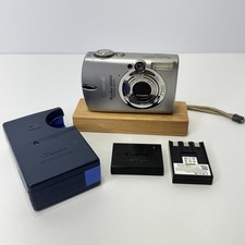 Canon PowerShot SD550 ELPH 7,1 MP fotocamera digitale argento con caricatore e batteria OEM