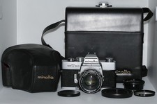 Minolta SRT 303 + MC Rokkor-PF 55 mm f/1.7 + filtro + custodia + mezza custodia