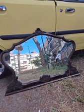 Specchio  intatto a mercurio e cornice in legno intagliato   color noce.