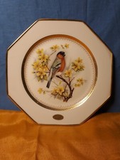 N. 3 piatti in porcellana Limoges con decorazioni oro ed uccelli