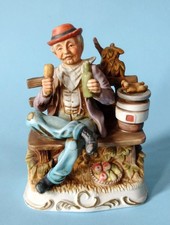 Statua in Ceramica di “Capodimonte” Vecchio Seduto su Panchina Vintage Anni ’70