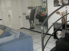 Mobile entrata in legno nero, con specchi e luce incorporata.