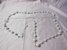 Collana perle con - perle, logo