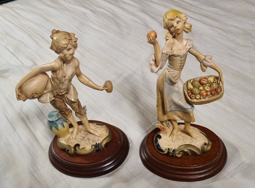 Coppia statuine resina - in,