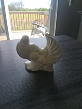 Statuina colomba coda