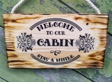 Targa insegna Welcome Cabin