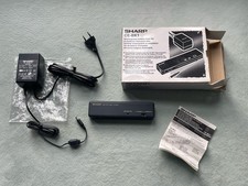 SHARP CE-BK1 - Batteria esterna + caricabatterie - CE BP1 / EA-23E - Ottime condizioni da collezione!