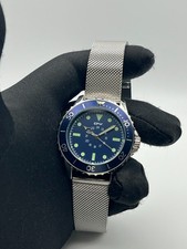 Orologio uomo lancette 24 ore ghiera girevole maglia milanese quadrante blu