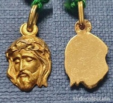 Ciondolo TESTA DI CRISTO. Oro giallo 18 carati. Peso 1,15 gr. 17 x 10 mm