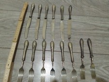 30. Lotto stock 14 posate antiche. 6 coltelli, 8 forchette
