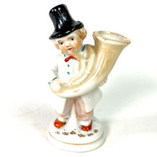 Statuina suonatore di tuba in