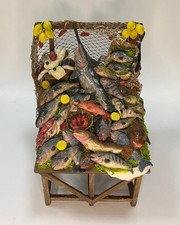 Banchetto pesce in cera per