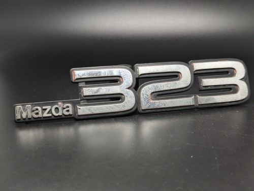 Mazda 323 logo sigla emblema - 323,