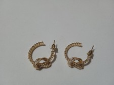 Orecchini semicerchio colore oro con nodo donna