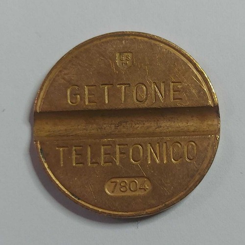 Gettone telefonico con - con, segno
