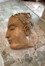 Scultura creta smaltata volto