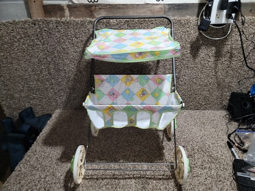 Bambola passeggino doppio