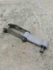 Shock absorber swing arm for