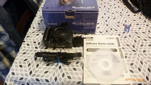 Canon powershot is - ,