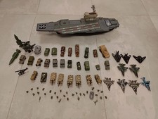 mezzi militari, portaerei, aerei, carri armati e altro