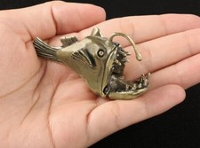 Statua animale pesce pescatore