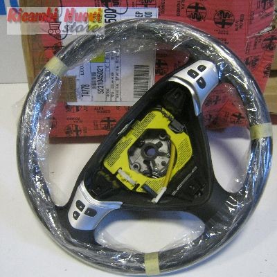 Volante pelle traforata con - pelle,