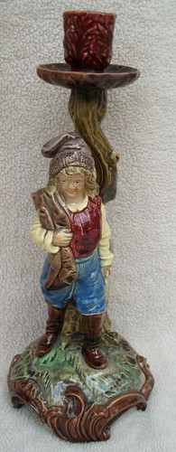 Antico candelabro figura
