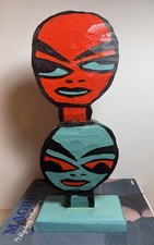 Scultura totem doppia faccia