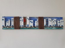 Quadro mare con legni e sassi creato su vecchia asse di legno ripulita 