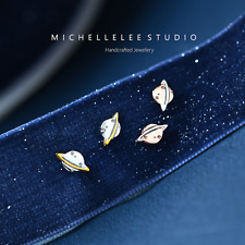 Orecchini a perno Saturno