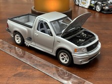 Burago Ford SVT F-150 Lightning Gold collezione argento scala 1/21 vedi foto HTF