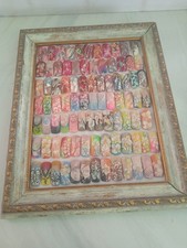 Quadro d'arredamento con unghie finte realizzate a mano