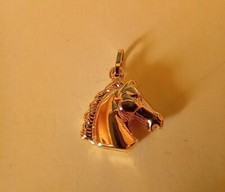 CIONDOLO   /  TESTA CAVALLO  /   gr.   2.10    oro giallo  18 KT