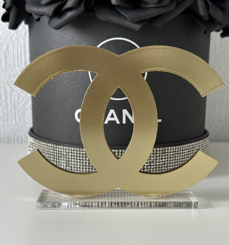 Chanel logo gold store display - store,