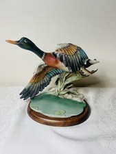 SCULTURA ANATRA VOLANTE