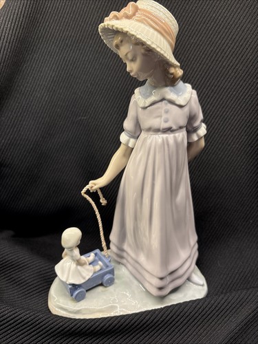 Lladro girl with - toy, wagon
