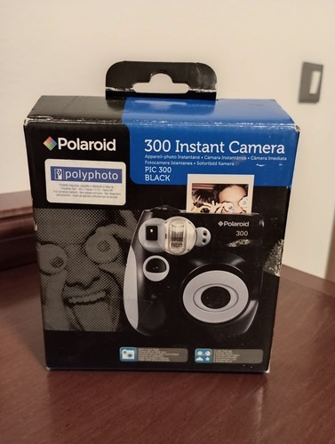 Polaroid 300 instant camera - -,