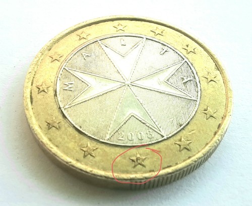 Una moneda euro - una,