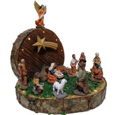 Grotta su tronco di natale con