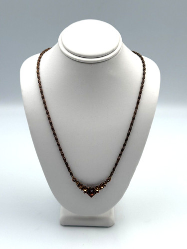 Collana tono rame marca - , 1928