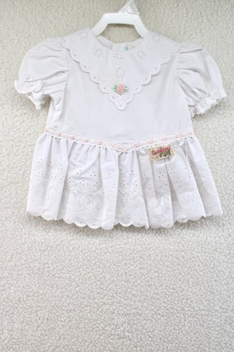 Vestito pizzo occhiellato