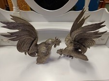 Coppia di sculture / statuette in metallo argentato raffiguranti galli vintage