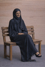 W37 – Seated Muslim Woman in