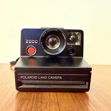 FOTOCAMERA VINTAGE POLAROID 2000 LAND CAMERA ISTANTANEA NERA 1976 RETRÓ ANNI 70