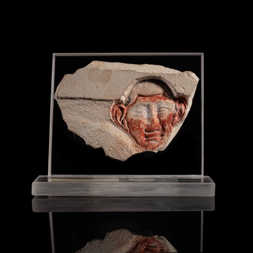 Frammento rilievo con - in,