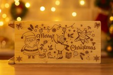 TAGLIERE IN LEGNO A SLITTA CON INCISIONI NATALIZIE