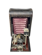 Antica macchina fotografica tascabile pieghevole Kodak n. 4 modello A soffietto rosso c.1906 letto legno