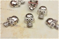 30pz Borchie sfuse forma teschi da cucire colore argento 1,5cmX2,5cm